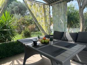 a table with fruit on it on a patio at Villa Julia in Nea Michaniona