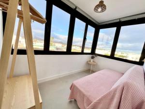 Postel nebo postele na pokoji v ubytování Casa de Los Soles