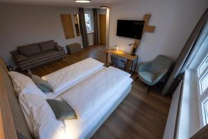 Postel nebo postele na pokoji v ubytování Hotel Adler