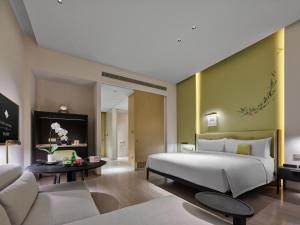 Postel nebo postele na pokoji v ubytování Maison Albar Hotels Leshan