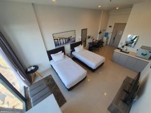 an overhead view of a bedroom with two beds at The Bridge Club in Phnom Penh