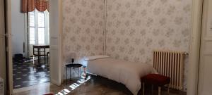 a bedroom with a white bed and a window at Residenza Donnafugata B&B in Ragusa