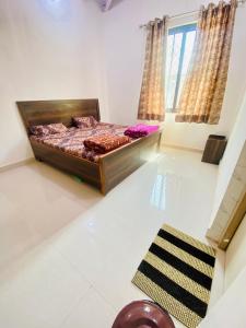 Katil atau katil-katil dalam bilik di Nirupam Sadan HomeStay