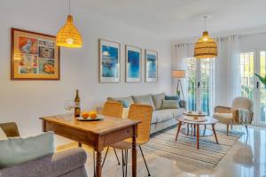 a living room with a couch and a table at Casita Bonita - with private garden near beach in Jávea in Jávea