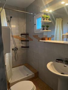 a bathroom with a toilet and a sink at SELO APARTMENTS in Nea Kalikratia