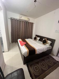 Krevet ili kreveti u jedinici u objektu Hotel Shree Prabhu