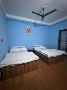 Postel nebo postele na pokoji v ubytování Hotel Atithi Devo Bhava