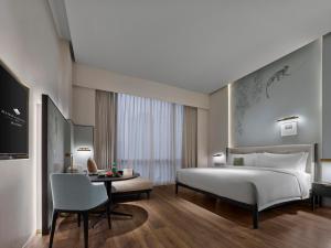 Postel nebo postele na pokoji v ubytování Maison Albar Hotels Leshan