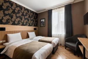 Postel nebo postele na pokoji v ubytování Hotel Old Wall