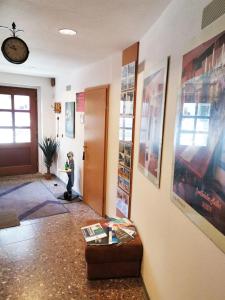 a living room with a dog sitting in front of a door at Gästezimmer- und Ferienzimmer Am Gewölbekeller Meißen in Meißen