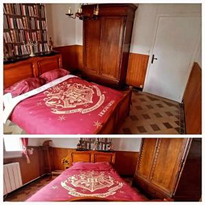 a bedroom with a bed with a red bedspread at Le Relais de la Mandragore 