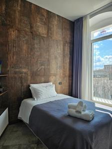 Postel nebo postele na pokoji v ubytování Binario1 Rooms