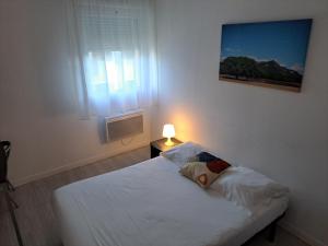 Postel nebo postele na pokoji v ubytování Résidence Les Académies Aixoise
