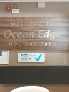 a welcome sign for an ocean edge holiday park at Roadnights Retreat in Heysham