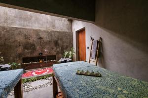 a dining room with a table and a fireplace at The Elementum in Uluwatu