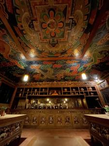 a room with a ceiling with a painting on it at Mountain Lodges of Nepal - Lukla in Lukla