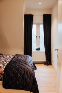 Postel nebo postele na pokoji v ubytování Castellum Residence Brugge