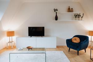 TV a/nebo společenská místnost v ubytování Castellum Residence Brugge