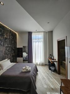 Postel nebo postele na pokoji v ubytování Binario1 Rooms