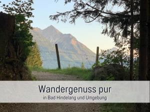 a sign that reads wandergence put in bad influencing mind influencing influencing mountain at Ferienwohnungen Scholl - private Sauna oder Infrarotkabine in Bad Hindelang