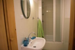 a bathroom with a sink and a shower with a mirror at Słoneczne Wzgórze in Szczawnica +7 photos