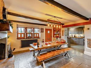 a kitchen with a large wooden table in a room at 4 Bed in Marsden 94015 in Marsden