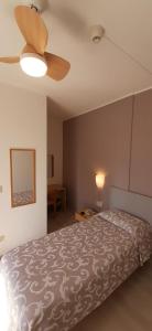 Postel nebo postele na pokoji v ubytování Albergo Centrale