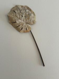 a leaf shaped object on a wall at RELAX Seefeld Apartman in Seefeld in Tirol