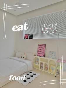 Ein Bett oder Betten in einem Zimmer der Unterkunft Jeju Homestay
