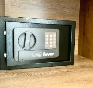 a television with a remote control on a wooden floor at Apartma Casa della Pizza - Parking included in Izola +42 photos