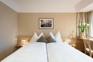 Postel nebo postele na pokoji v ubytování Hotel Johann