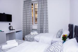 Voodi või voodid majutusasutuse Pallada toas