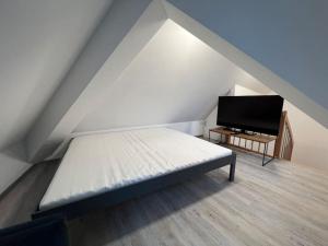 TV a/nebo společenská místnost v ubytování Zentrale Wohnung in Prüm für Traum-Urlaub