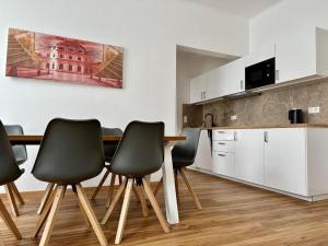 Kuchyň nebo kuchyňský kout v ubytování Hotel Klimt