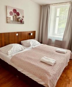 Postel nebo postele na pokoji v ubytování Hotel Klimt