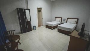 Voodi või voodid majutusasutuse Planters Guest House toas