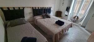 Postel nebo postele na pokoji v ubytování Casa Noemi