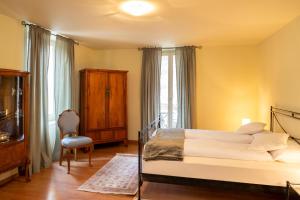Postel nebo postele na pokoji v ubytování Locanda Villa d' Epoca
