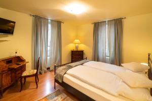 Postel nebo postele na pokoji v ubytování Locanda Villa d' Epoca