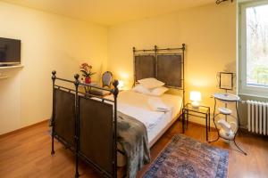 Postel nebo postele na pokoji v ubytování Locanda Villa d' Epoca