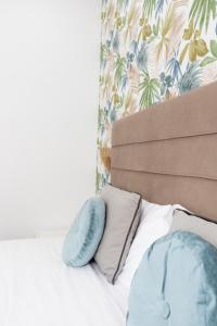 A bed or beds in a room at 247 Luxury Rooms Trastevere