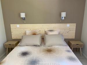 En eller flere senge i et værelse på Villas Pelvoux Aster