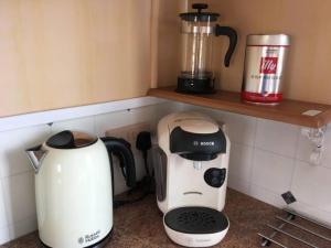 a coffee maker and a blender on a counter at Heaste Retreat in Broadford