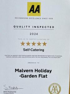 a white envelope with insurance renewal certificate at Malvern Holiday- Garden Flat in Great Malvern