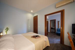 Postel nebo postele na pokoji v ubytování Hotel Mariani