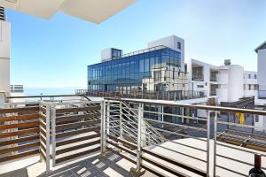 a view of a building from a balcony at Eden On The Bay 118 by HostAgents in Bloubergstrand