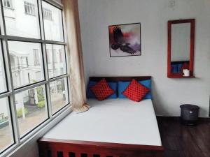 Llit o llits en una habitació de TravelNest