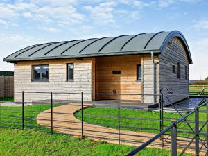 a small wooden building with a metal roof at 2 Bed in Castle Cary 94021 in Babcary