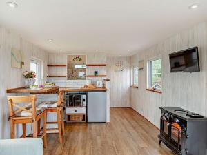 a kitchen with a counter and a stove at 1 Bed in Bridport 94154 in Chideock
