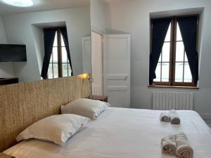 Postel nebo postele na pokoji v ubytování le Royal XIX vue mer 212